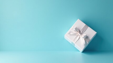 A single elegantly wrapped gift box rests on a serene pastel blue surface, suggesting a thoughtful present or special occasion