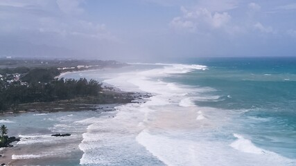 Aerial view of powerful high waves crashing in the Indian Ocean during a cyclone in Mauritius, capturing the intensity of the storm