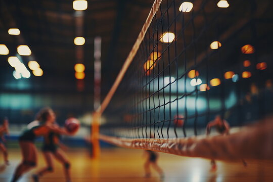 Side view of volleyball net in gym with sunset light. Great for indoor sports backgrounds, youth athletics promotions, fitness events, or volleyball match posters.

