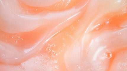Obraz premium Close up of light peach oil substance texture for skincare or cosmetic design