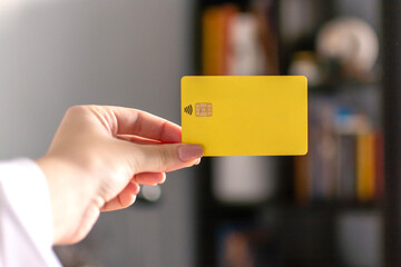 female hand holding credit card