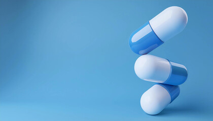 A group of white and blue medicine capsules  balancing on top of each other. Space for text