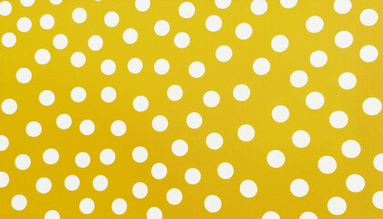 Yellow and beige colored polkadot pattern background with dots in abstract shapes and sizes as stylish wallpaper design or wrapping paper