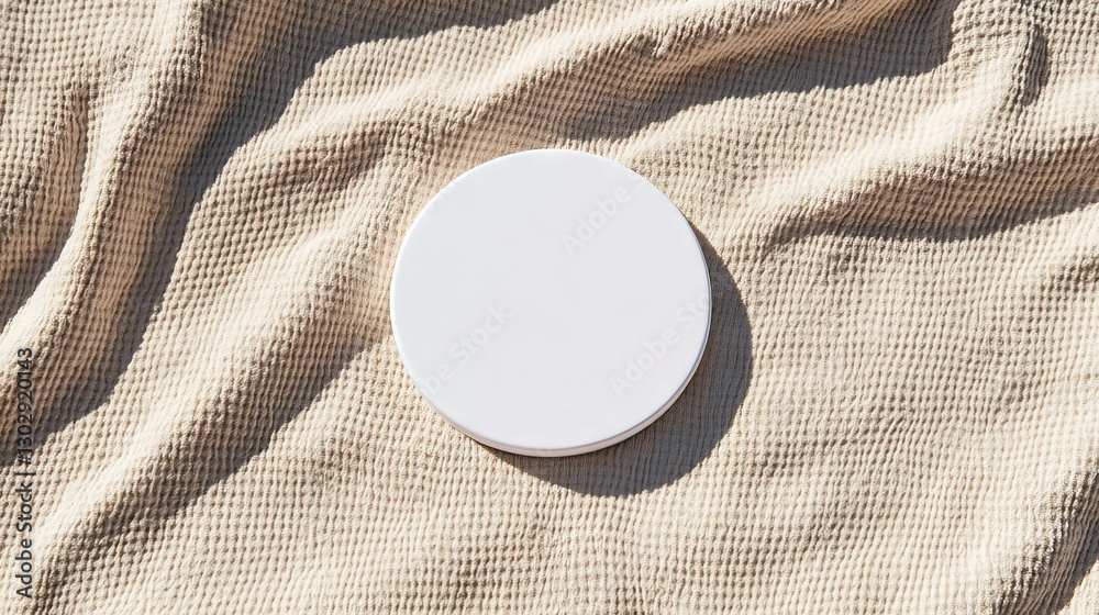 Aufkleber minimalist overhead view of a white circular podium on textured fabric surface for product display