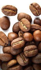 Color photo. Textured background. Coffee beans scattered on white background. Wallpaper. Cover. Postcard. Advertisement