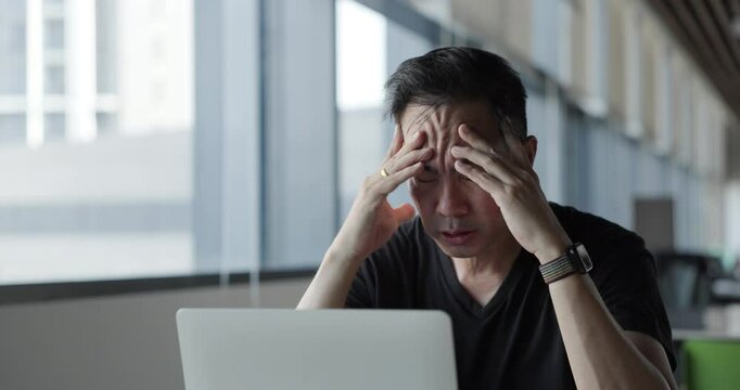 Asian businessman burn out on failed job in office. Elderly office worker expresses emotions Failed to work No success. Financial Communication Business problem. Working too hard overtime