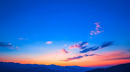 Fototapeta premium Breathtaking sunset over a mountainous landscape with vibrant colors and a clear sky