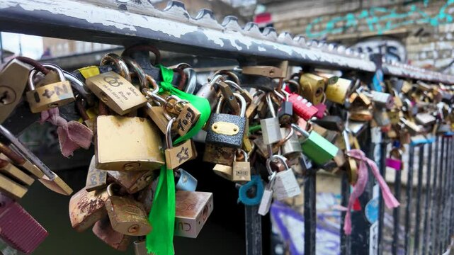 Close-up of love locks attached to a bridge railing &ndash; Symbol of forever love