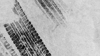 Black tire marks on road, Black rubber tire marks and tread marks, Tire trace track wheels texture...
