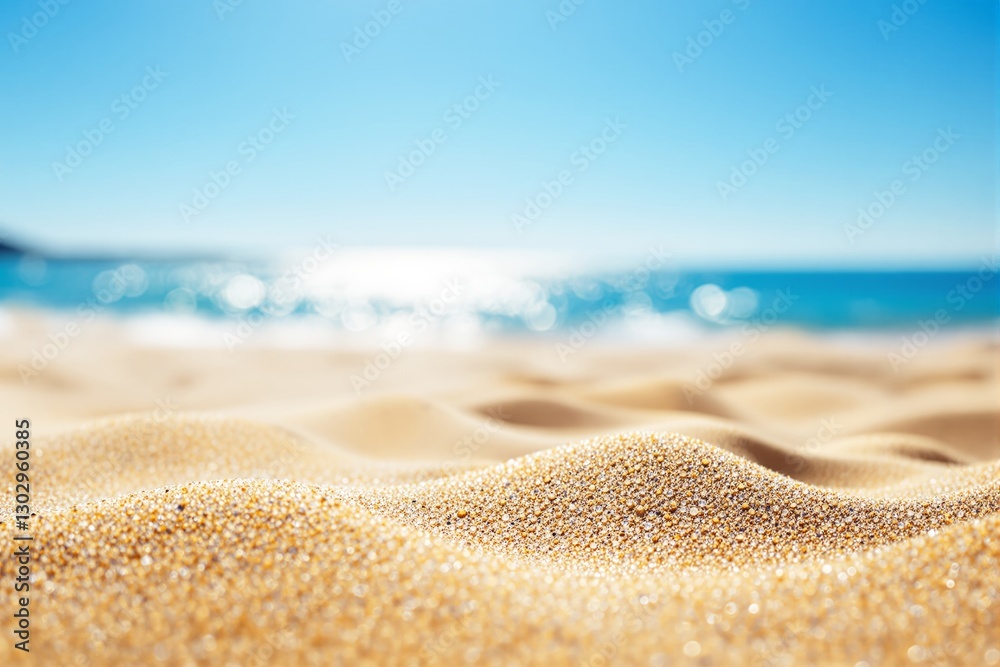 Poster close-up of sand on a beach with ocean in the background.