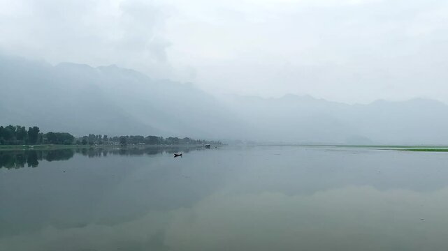 A view of Dal Lake in summer, and the beautiful mountain range in the background in the city of Srinagar, Kashmir, India.
