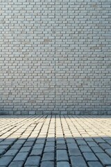 Fototapeta premium A Light Grey Brick Wall and Cobblestone Pavement A Simple Architectural Background