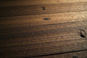 Obraz premium Rich brown wood, uneven surface, aged appearance, wooden planks, rustic texture