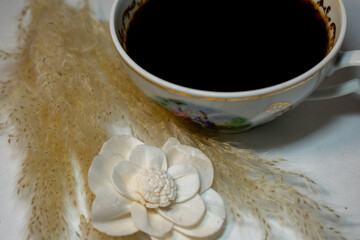 porcelain cup with black coffee