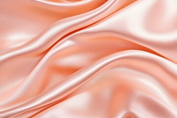 Obraz premium Luxurious rose gold satin fabric with soft folds illuminated by delicate lighting creating an elegant texture for sophisticated designs