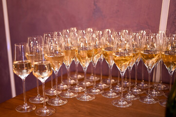 glasses of white wine on the table.