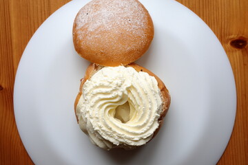 Swedish pastry called semla. Open lid. Traditional fika dessert. Above angle.