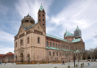 Speyer Cathedral on a sunny day, showcasing its Romanesque architecture. Various views highlight the historic towers, sandstone facade, and intricate details of this UNESCO World Heritage 