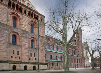 Speyer Cathedral on a sunny day, showcasing its Romanesque architecture. Various views highlight the historic towers, sandstone facade, and intricate details of this UNESCO World Heritage 