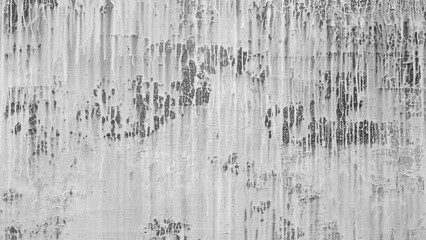 A black white wall with many scratches and marks as a textured background. wall looks old and worn, with sense  decay and abandonment. scratches and marks give  painting a sense of depth and texture.