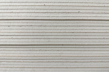 stack of drywall construction sheets	