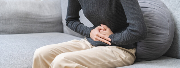 Flatulence ulcer, asian young woman, girl hands in belly, stomach pain from food poisoning,...