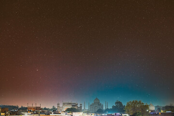Taj Mahal In Agra, Uttar Pradesh, India. Night view Of Taj Mahal. Seven World Wonders. Night stars above Fabulous Taj Mahal Travel Concept. Indian Islamic Heritage At Night Time