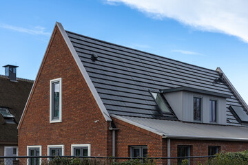 Integrated solar panels close up. Photovoltaic panels in the roof. Detail roof Of Solar Panels. View of solar panels (solar cell) in the roof house.
