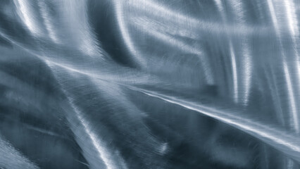 abstract blue textured background  blurred metallic texture that appears to be reflection of silver object. texture is smooth and shiny, giving it sleek and modern look. scene is one of sophisticated