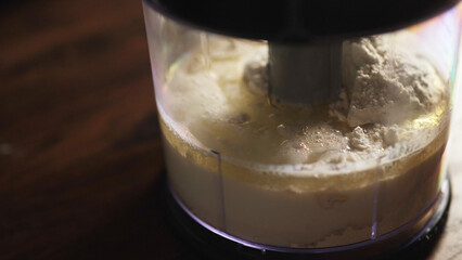 Kneading the dough in a dough mixer.