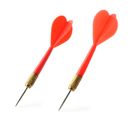 Red dart arrows in air isolated on white. Sports equipment