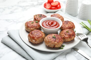 Delicious patties served on white table, closeup