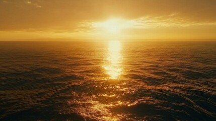 Fototapeta premium Ocean horizon at sunrise, golden light reflecting on the water, calm waves, peaceful seascape