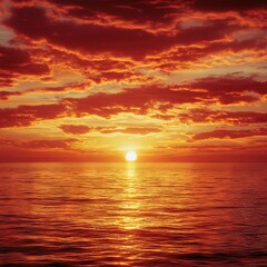 Obraz premium Fiery sunset casting vivid orange hues across the ocean and dramatic cloudscape.