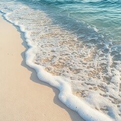 Gentle waves lapping onto a pristine sandy shore in soothing turquoise hues.