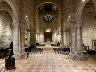 Interior of Basilica di San Zeno Maggiore church in Verona with chairs