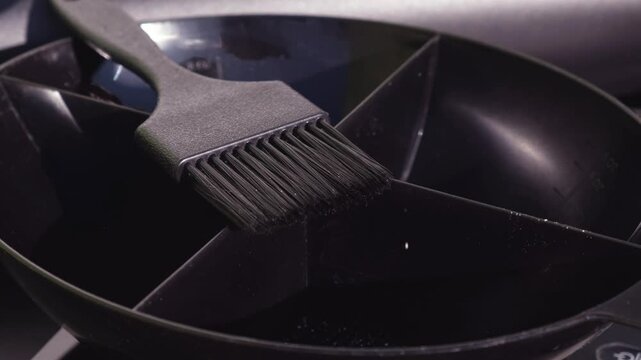 Falling oxidizer into powder or hair lightening dye close-up