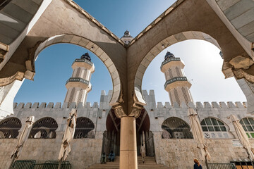 Arches and Minaret of the Touba Mosque the holy place for Senegali muslim people Touba Senegal