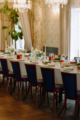 Elegant Dining Table Set for a Special Occasion with Floral Arrangements