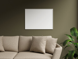Chic white frame mockup against a dark green wall, highlighting a cozy sofa with textured cushions and a decorative plant nearby.
