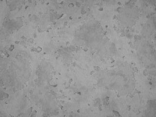 Rough gray concrete surface with scattered patches and water stains.