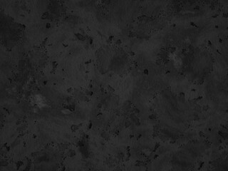 Dark concrete surface with irregular stains and a slightly worn texture.