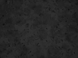 Worn dark concrete with rough texture and scattered discoloration.