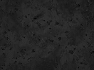 Dark gray concrete surface with stains and uneven patches throughout.