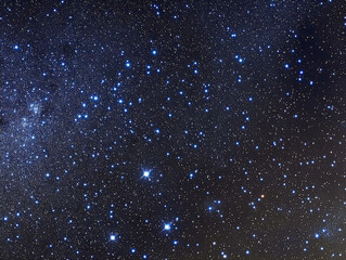 Fototapeta premium Venturing into a mesmerizing blue galaxy reveals a canvas of countless stars twinkling brightly against the deep cosmic backdrop. This celestial display captures the essence of space's beauty