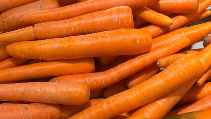 Fresh Orange Carrots Stacked Together at a Local Farm Market Showcasing Vibrant Produce