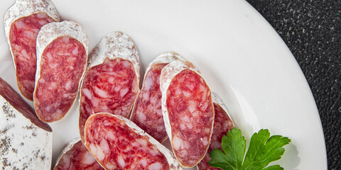 Fuet sausage Spanish meat delicacy fresh delicious gourmet food background on the table rustic food top view copy space
