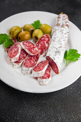 Fuet sausage Spanish meat delicacy fresh delicious gourmet food background on the table rustic food top view copy space