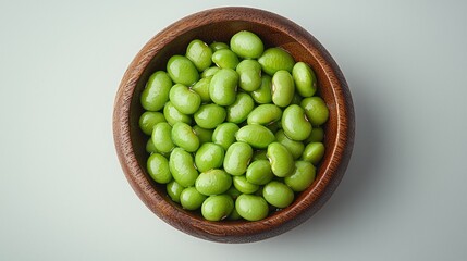 Wooden bowl of fresh green beans, studio shot