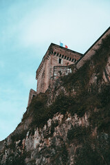 Castle on Cliff with Flags
